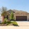 Rosharon TX Friendly Single Family Homes for Rent - Alterra at Sierra Vista - Brick Building Exterior with a Grassy Lawn and Sign Outside