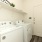 Laundry room with washer and dryer included in a new rental home at Alterra Sierra Vista, near Sugar Land, TX. Convenient and modern amenities.