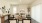 Bright and modern living room in a newly constructed home at Alterra Sierra Vista, near Iowa Colony, featuring wood flooring and natural light.