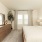Spacious master bedroom in a newly constructed rental home at Alterra Sierra Vista, featuring modern furnishings and natural light near Pearland, TX.