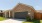 Pet-friendly, one-level home for rent near Pearland, TX, featuring a two-car garage, modern brick exterior, and fenced backyard.