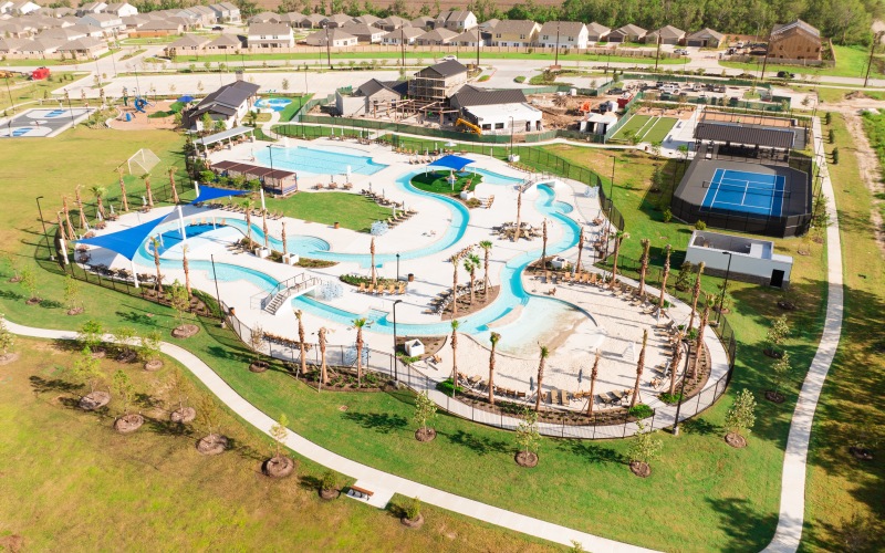 Aerial view of resort-style amenities, lazy river, and tennis courts at Alterra Sierra Vista in Rosharon, TX. Community located right across the center.