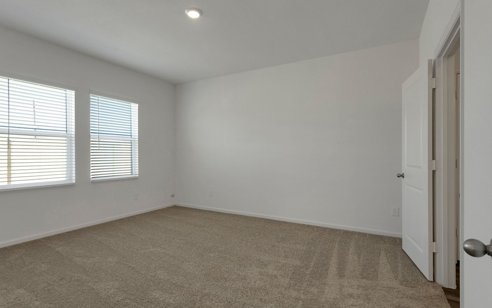 Bedroom with natural lighting and high ceilings